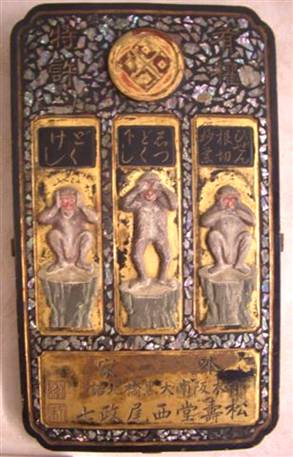 Japanese Pharmacy signboard with the three wise monkeys, that hear, see and speak no evil